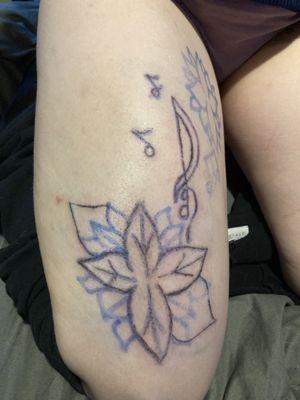 Tattoo of flower, music note