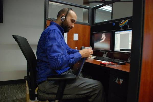 One of our service members working on a business laptop.