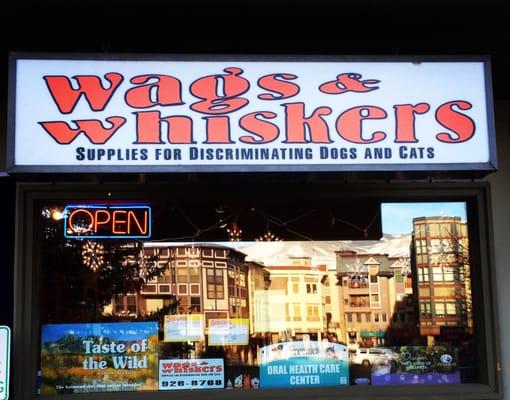 Our storefront with Riverwalk reflected from across the street.