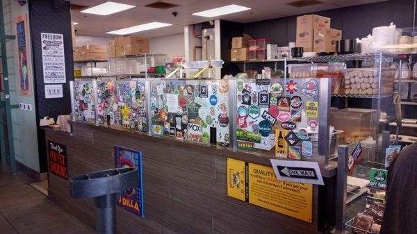 Behind this counter, sandwiches are made.