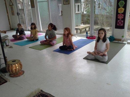 Little Yoginis learning beginning meditation