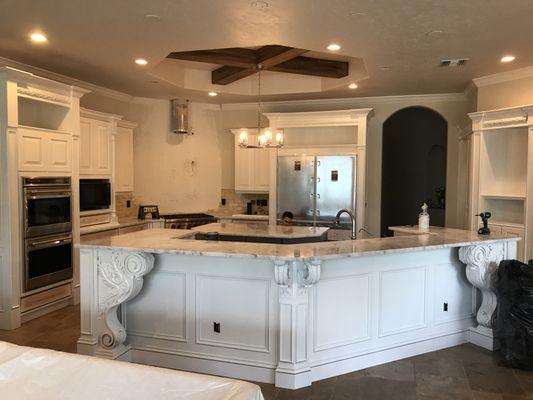 kitchen refinished in white. Was previously a dark brown stain color.