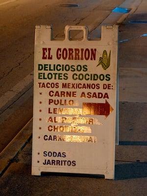 El Gorrion sign with their menu.