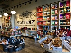 Interior of store showing our huge selection of dog food, bones, toys, and treats.