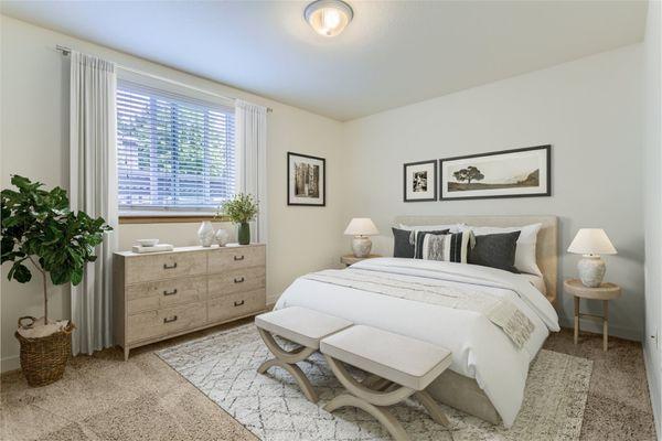 Spacious bedroom with natural light.