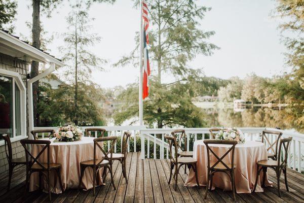 Tables, satin linens, cross-back chairs