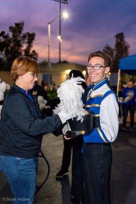 Timothy Holmes receiving his plume for the last time before the SCSBOA Marching Band 6A Championships