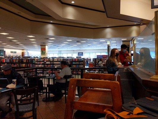 Coffee shop seating area plus some of the bookstore