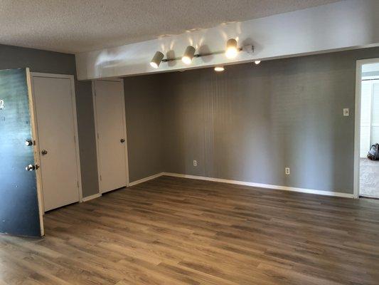 Faux wood floors downstairs living room, huge living room!