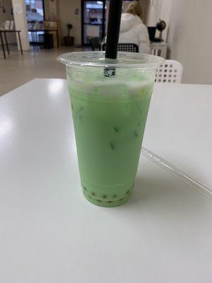 Honeydew Milk Tea with mango popping boba