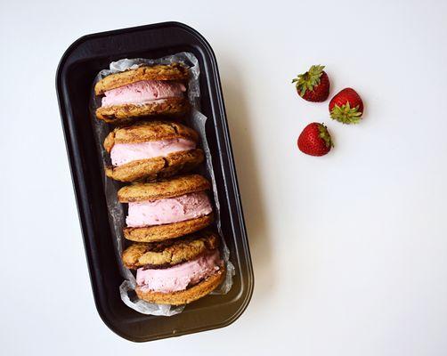 Ice cream sandwiches made with Chocolate Chunks cookies & Strawberry Cheesecake Ice Cream