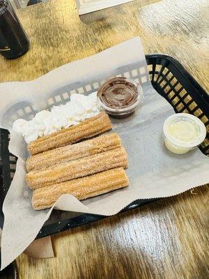 Churros made to order with chocolate dip and sweet cream