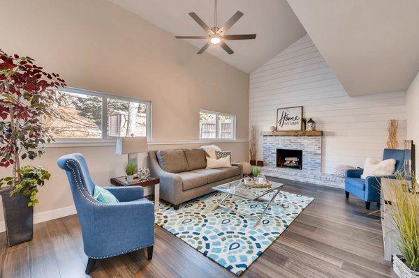 Recent remodeled property with fully refinished fireplace and shiplap wall.