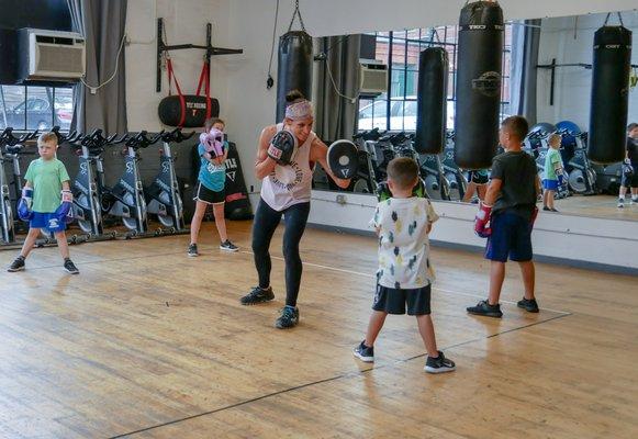 Trainer Karen teaching out Boxfit Kids class