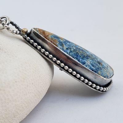 Azurite blue gemstone wrapped in beaded sterling silver and accented with a 14k gold nugget. Always one-of-a-kind.