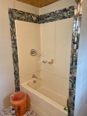 Glass deco tile shower surround.