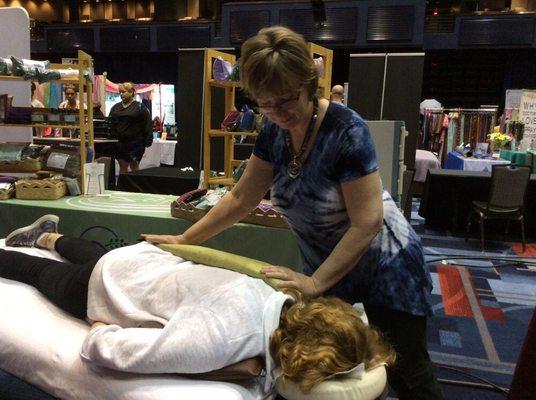 Demonstrating spinal massage techniques