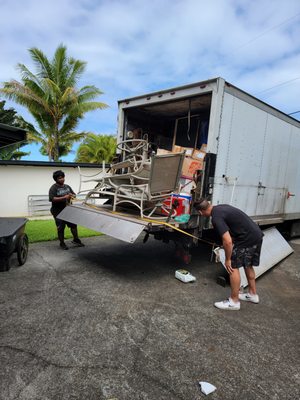 The garden furniture strapped to the back of their truck.