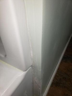 The siding of the tub that is also now leaking