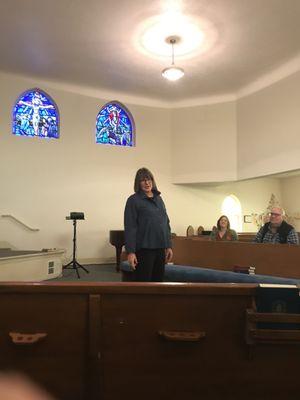 Pastor Kathy giving a sermon.