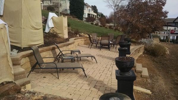 Patio pavers are Cambridge Cobble color is Sierra. The block is Gravity segmental block color is Buff.