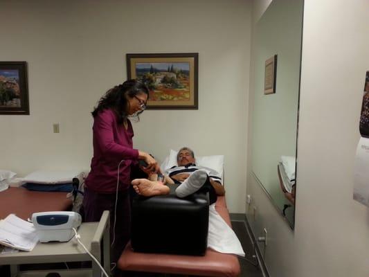 Christina, our Reiki specialist, using her magic touch on a patient.