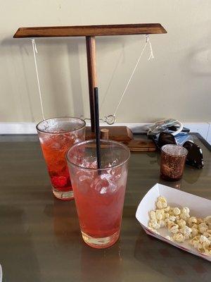 Shirley temple for the little, a vodka with grapefruit and cranberry for the mom. Popcorn for everyone!