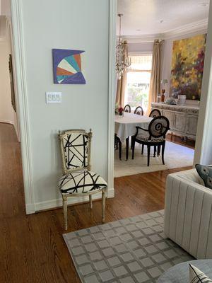 Accent chair in abstract velvet. Boxed seat cushions on dining room chairs.