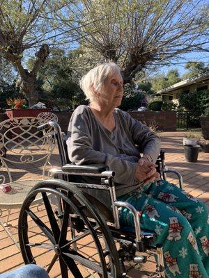 My mom on the patio enjoying the beautiful day.