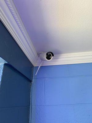 Crown molding and security camera installation