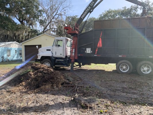 Our loader trucks cleaning up debris.