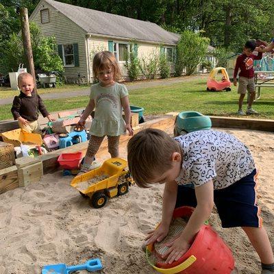 Joyful Adventures Unfold as Little Explorers Conquer the Sandbox at Preschool!