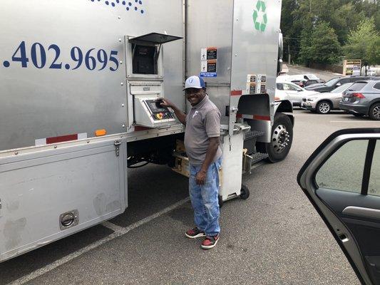 Owner with shredding truck