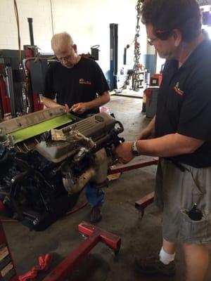 Stacy and AL finishing up the assembly of 5.7 engine for a Corvette.