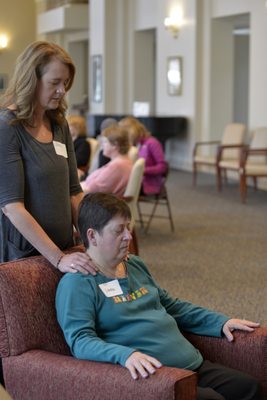 Program participant is guided through the "M Technique", gentle touch and massage perfect for cancer patients.