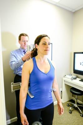 Dr. Harrison checking his patient's alignment with the Anatometer.