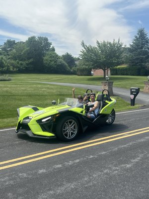 Couples enjoying a beautiful day, driving in style.