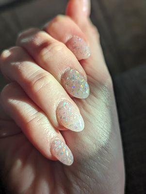 Beautiful rainbow sparkle dip manicure