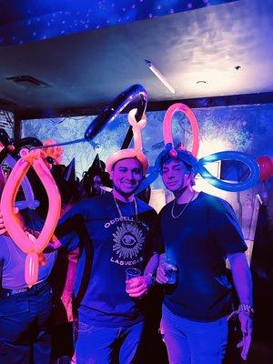 two bro's just hanging with ballon hats charlie made