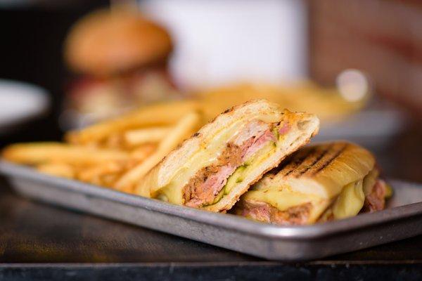 Cuban- Braised pork shoulder, Parma cotto, fontina, pickles, Dusseldorf mustard, fries.