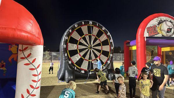 Inflatable throwing games for foot ball and base ball teams. Provided by Bounce Then Slide party rentals.