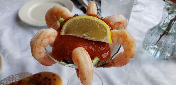 Shrimp cocktail, slightly overcooked but great flavor.