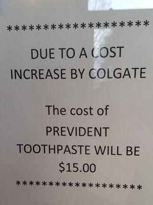 Sign posted in plain sight to advise patients that because of a cost increase by Colgate, the charge for Prevident toothpaste is $15.00.