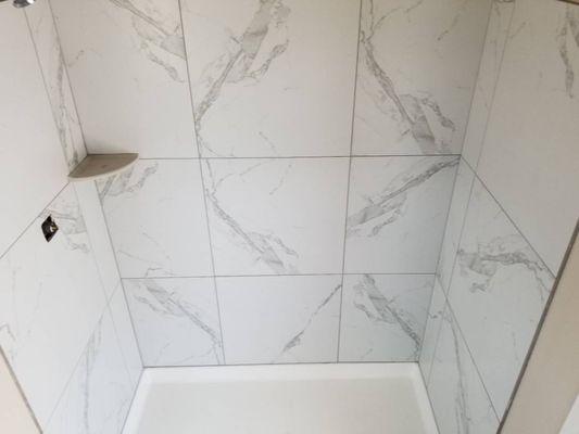 Hall shower with 24 x 24 porcelain tile on shower walls