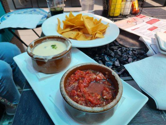 Chips and salsa with queso dip.