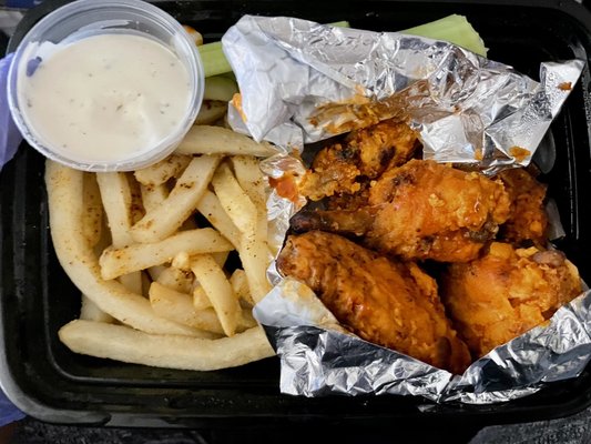 Buffalo (hot) wings with fries and ranch dipping sauce.