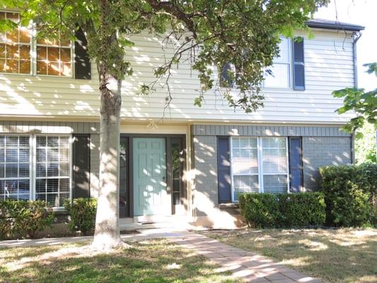 Olive brick and dark shutters to go with existing cream siding