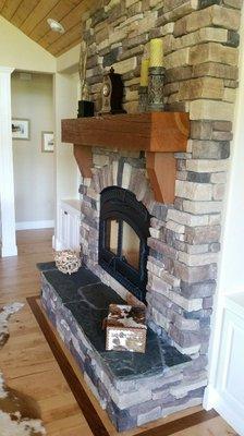 Rock fireplace & reclaimed mantel.