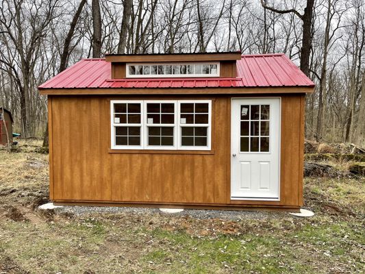 Custom shed insulated with added electrical package and finished with tongue and groove board for an office / guest space.