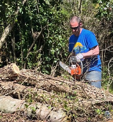 Cutting down to size to remove a fallen tree off a client property.